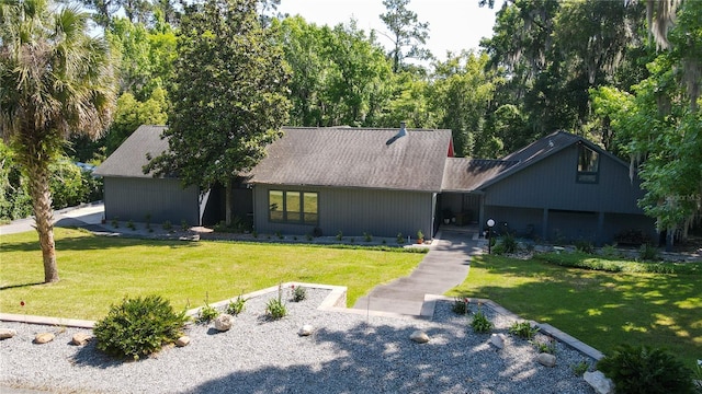 mid-century inspired home featuring a front yard