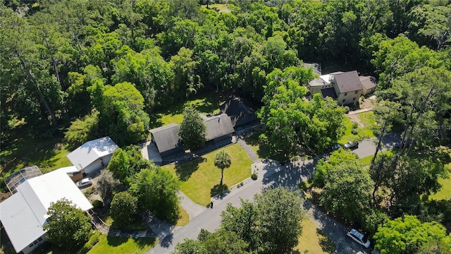 drone / aerial view featuring a forest view