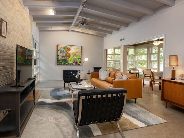 living room with lofted ceiling with beams, brick wall, ceiling fan, and visible vents