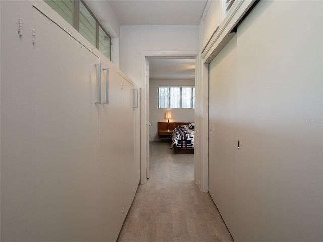 hallway featuring light wood-style flooring