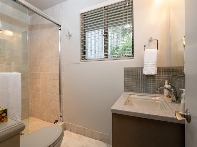 full bathroom featuring toilet, a shower stall, tasteful backsplash, and vanity