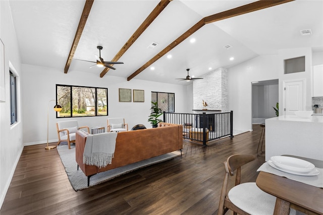 living area featuring vaulted ceiling with beams, recessed lighting, visible vents, baseboards, and dark wood finished floors