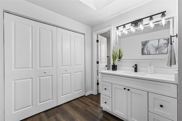 bathroom featuring wood finished floors and vanity