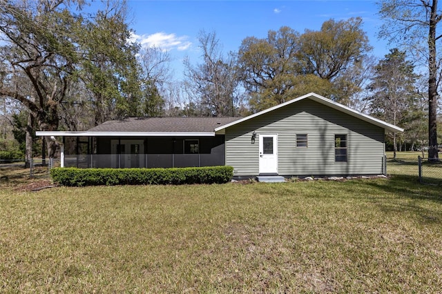 view of front of property with a front lawn and fence