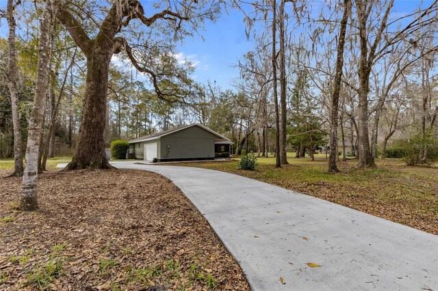 view of front of home featuring concrete driveway