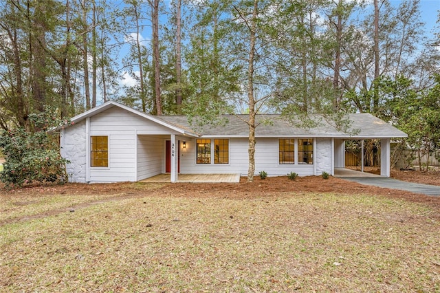 ranch-style home with a porch, a carport, and a front yard