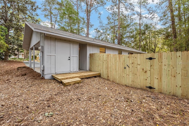 view of outbuilding with fence