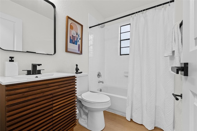 bathroom featuring shower / tub combo, vanity, toilet, and wood finished floors