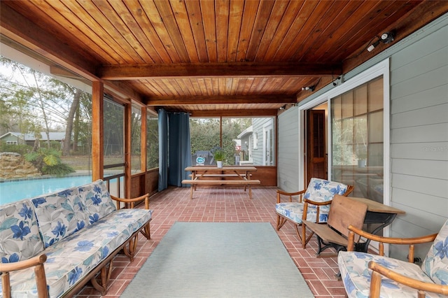 sunroom / solarium with wooden ceiling and beam ceiling