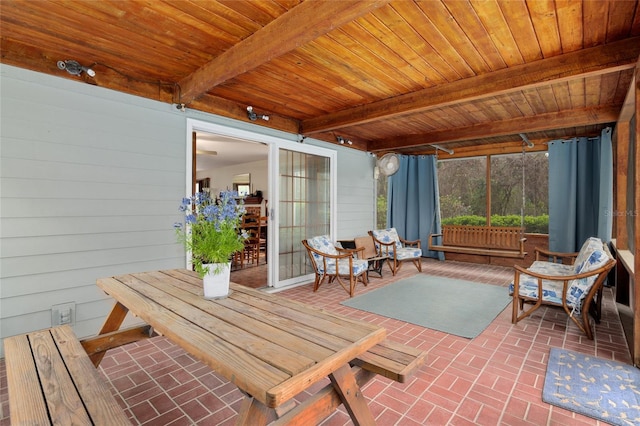 sunroom with beamed ceiling and wooden ceiling