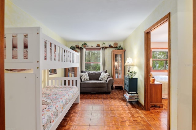 bedroom with multiple windows