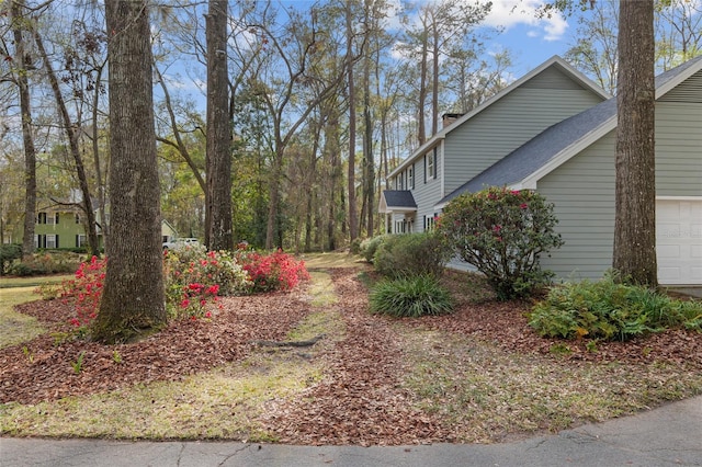 view of yard featuring an attached garage