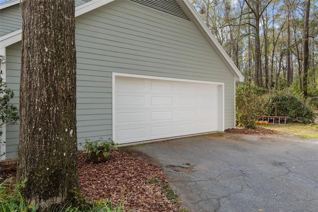 garage featuring driveway