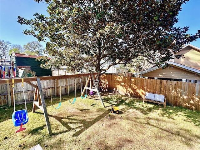 view of play area featuring a fenced backyard and a lawn