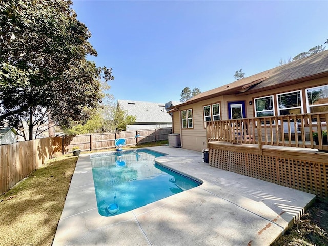 view of swimming pool featuring a deck, a patio, a fenced backyard, and a fenced in pool