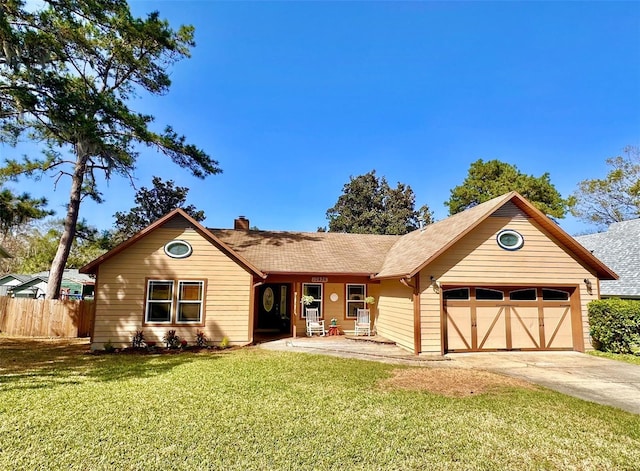 ranch-style house with a chimney, fence, a garage, driveway, and a front lawn