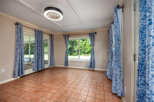 spare room featuring light tile patterned floors, baseboards, and ornamental molding