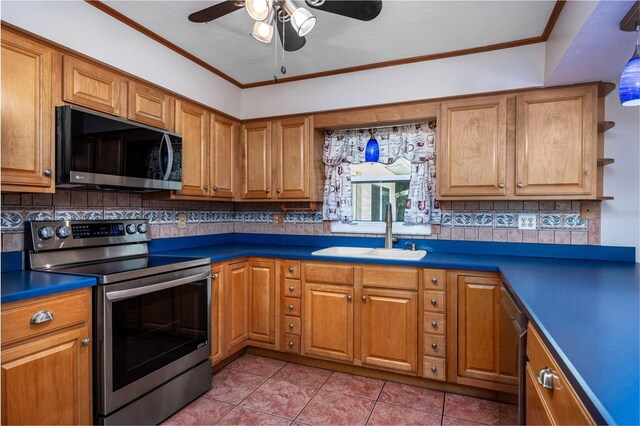 kitchen with a sink, crown molding, backsplash, and stainless steel appliances