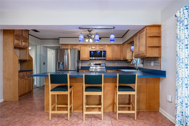 kitchen with open shelves, a sink, stainless steel appliances, dark countertops, and backsplash