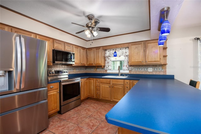 kitchen with a sink, stainless steel appliances, backsplash, and dark countertops