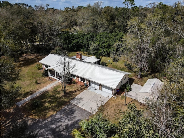 drone / aerial view with a view of trees