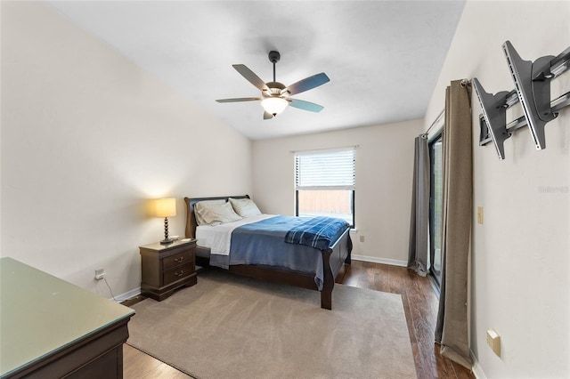 bedroom featuring a ceiling fan, baseboards, and wood finished floors