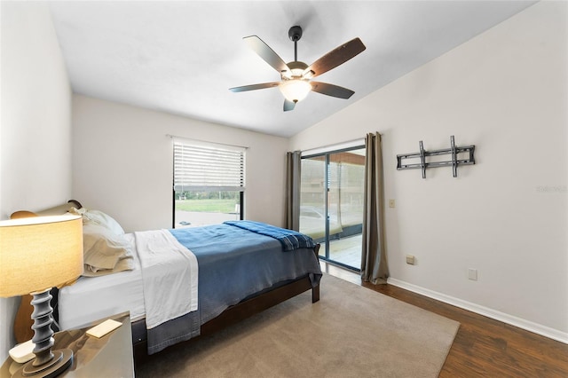 bedroom featuring a ceiling fan, vaulted ceiling, wood finished floors, access to outside, and baseboards