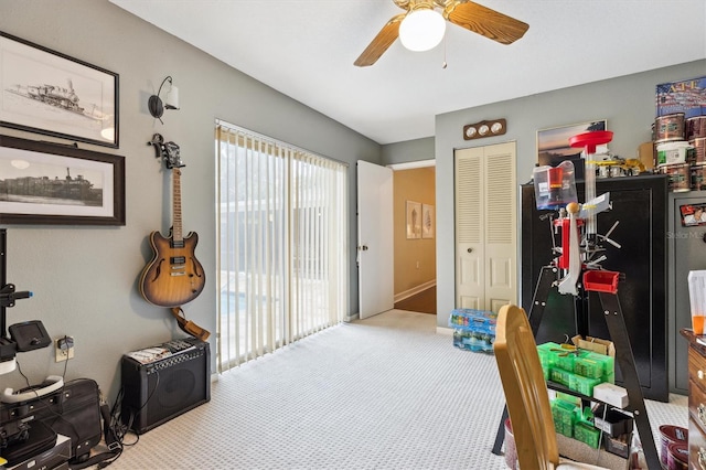 miscellaneous room with carpet and a ceiling fan