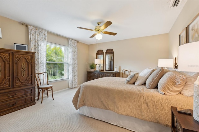 bedroom featuring baseboards, carpet, visible vents, and a ceiling fan