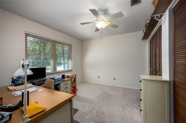 office space featuring ceiling fan, carpet, visible vents, and baseboards