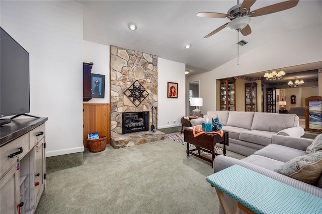 carpeted living area with ceiling fan with notable chandelier, a fireplace, visible vents, baseboards, and vaulted ceiling