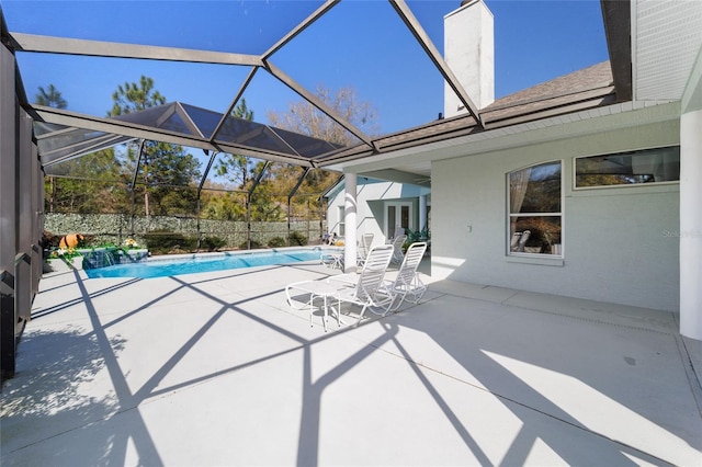 view of pool with french doors, a patio area, and a fenced in pool