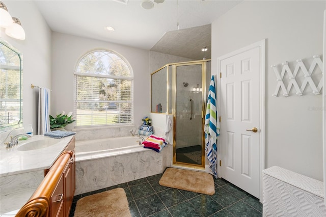 full bathroom featuring a garden tub, a shower stall, tile patterned flooring, and vanity