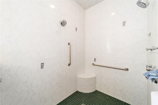 full bath with a tile shower