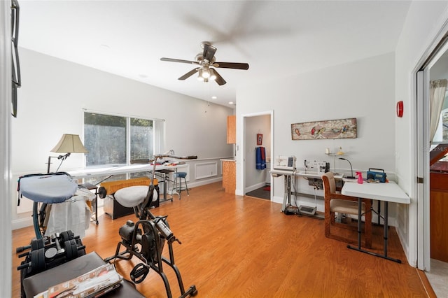 office area with light wood-type flooring and a ceiling fan