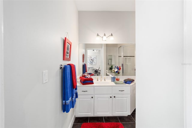 bathroom with a shower stall, vanity, and tile patterned floors