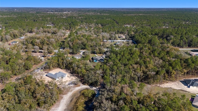 bird's eye view with a forest view