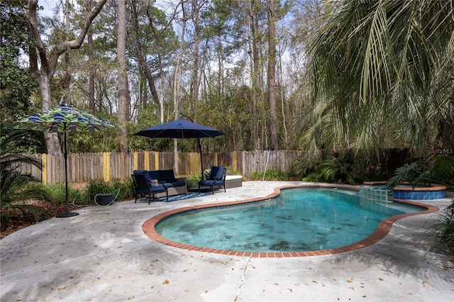 view of swimming pool with a fenced in pool, a patio, and fence