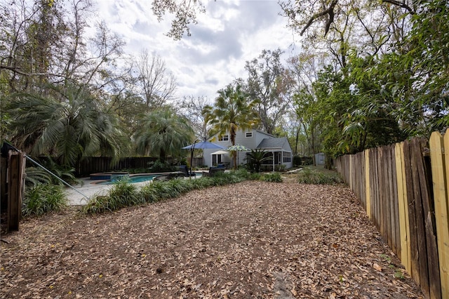 view of yard with a fenced in pool, a patio area, and a fenced backyard