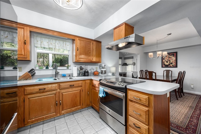 kitchen featuring under cabinet range hood, a peninsula, a sink, electric stove, and brown cabinets