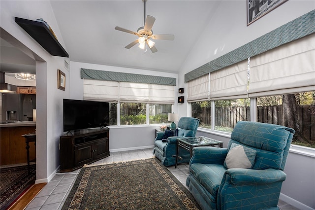 sunroom / solarium with vaulted ceiling and a ceiling fan