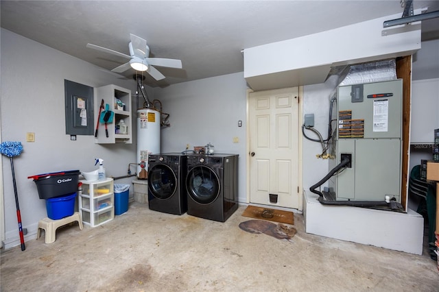 laundry room featuring a ceiling fan, washer and dryer, and water heater