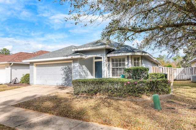 view of front of property featuring a garage, a shingled roof, central AC unit, concrete driveway, and fence