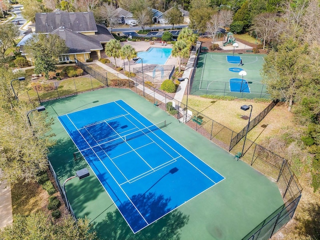 view of sport court with fence and playground community