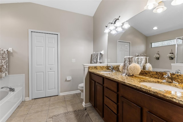 full bath with tile patterned flooring, a bath, a closet, and a sink