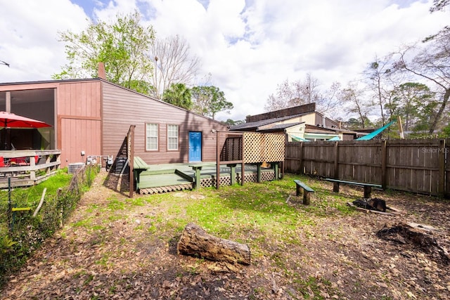 view of yard with a wooden deck