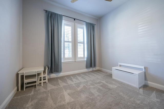 unfurnished room with baseboards and carpet floors