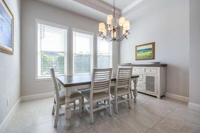 dining area with light tile patterned flooring, a notable chandelier, and baseboards