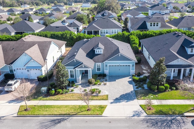 birds eye view of property with a residential view