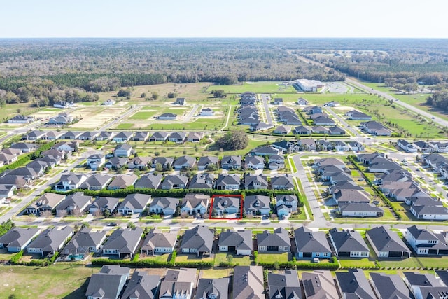 birds eye view of property with a residential view